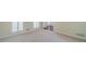 Bright room with plantation shutters and a view of the entrance at 4610 Admiral Ridge Way, Lilburn, GA 30047