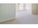 Spacious room featuring wainscoting and ample natural light at 4610 Admiral Ridge Way, Lilburn, GA 30047