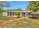 View of the backyard, showing the home, patio doors, and deck at 744 Martin Rd, Stone Mountain, GA 30088