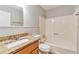 Bathroom featuring a shower-tub combo, granite counters and a modern sink at 744 Martin Rd, Stone Mountain, GA 30088