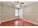 Bedroom featuring hardwood floors, neutral paint and a ceiling fan at 744 Martin Rd, Stone Mountain, GA 30088