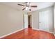 Bedroom featuring hardwood floors, ceiling fan, and neutral paint at 744 Martin Rd, Stone Mountain, GA 30088