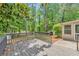 Enjoy outdoor living on this spacious wood deck with railings, surrounded by lush trees at 744 Martin Rd, Stone Mountain, GA 30088