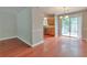 Open dining area with sliding door access to the backyard and convenient kitchen access at 744 Martin Rd, Stone Mountain, GA 30088