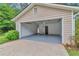 Spacious two-car garage with freshly painted walls and flooring for easy maintenance at 744 Martin Rd, Stone Mountain, GA 30088