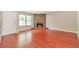 Cozy living room features beautiful wood floors and stone fireplace at 744 Martin Rd, Stone Mountain, GA 30088