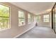 Bright sunroom with multiple windows providing lots of natural light and backyard views at 744 Martin Rd, Stone Mountain, GA 30088