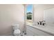 Stylish half-bathroom with modern fixtures, a marble countertop, and patterned tile flooring at 110 Hogue St, Atlanta, GA 30312