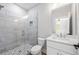 Well-lit bathroom featuring a glass-enclosed shower and modern vanity at 110 Hogue St, Atlanta, GA 30312