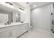 Elegant bathroom with double vanity, quartz countertops, and modern fixtures at 110 Hogue St, Atlanta, GA 30312