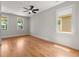 Serene bedroom with hardwood floors, neutral walls, and windows providing ample natural light at 110 Hogue St, Atlanta, GA 30312