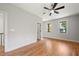 Spacious bedroom featuring hardwood floors, two windows, and modern ceiling fan at 110 Hogue St, Atlanta, GA 30312