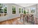 Bright dining room featuring hardwood floors, modern lighting, and a natural wood table set at 110 Hogue St, Atlanta, GA 30312