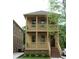 Charming two-story home with a welcoming porch and a well-manicured front yard in a neighborhood at 110 Hogue St, Atlanta, GA 30312