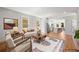 Open living room showcasing modern furniture, hardwood floors, and an adjacent kitchen area at 110 Hogue St, Atlanta, GA 30312