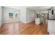 Bright living and kitchen area featuring hardwood floors, modern lighting, and a kitchen island at 110 Hogue St, Atlanta, GA 30312