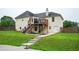 Two-story home with backyard, deck, steps, and swimming pool providing ample outdoor space for relaxation and entertainment at 409 Cold Springs Ln, Mcdonough, GA 30252