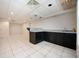 Finished basement features a wet bar with cabinetry and tile flooring at 409 Cold Springs Ln, Mcdonough, GA 30252