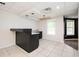 Basement featuring tile flooring, a wet bar, and access to an upper floor at 409 Cold Springs Ln, Mcdonough, GA 30252