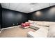 Finished basement boasts plush carpeting and a cozy seating area at 409 Cold Springs Ln, Mcdonough, GA 30252