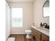 Bathroom featuring a window, vanity, toilet, stylish fixtures, and a shower with curtain at 409 Cold Springs Ln, Mcdonough, GA 30252