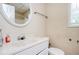 This full bathroom includes a single sink vanity and commode at 409 Cold Springs Ln, Mcdonough, GA 30252