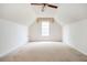 Bedroom with an angled ceiling, a window, and neutral carpeting for a cozy space at 409 Cold Springs Ln, Mcdonough, GA 30252