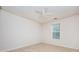 Bedroom showcasing neutral walls, carpet, ceiling fan, a window, and ample natural light at 409 Cold Springs Ln, Mcdonough, GA 30252