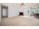 Bright living room with a fireplace, ceiling fan and access to outdoor patio through sliding glass doors at 409 Cold Springs Ln, Mcdonough, GA 30252