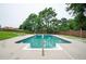 Swimming pool surrounded by concrete patio with stairs and landscaping in the background, perfect for summer fun at 409 Cold Springs Ln, Mcdonough, GA 30252