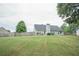 Expansive backyard featuring a fence and ample space for outdoor activities and enjoyment at 704 Stonecrest Ln, Loganville, GA 30052