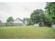 Extensive backyard with storage shed, providing privacy and room for recreation at 704 Stonecrest Ln, Loganville, GA 30052