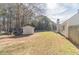 Large backyard with shed, offering ample space for outdoor activities and storage at 704 Stonecrest Ln, Loganville, GA 30052