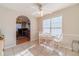 Dining area features tile floors, a ceiling fan, and an arched doorway at 704 Stonecrest Ln, Loganville, GA 30052