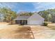 Charming single-story home with a two-car garage, stone accents, and inviting front porch on a spacious lot at 704 Stonecrest Ln, Loganville, GA 30052