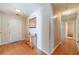 Welcoming foyer with hardwood floors, a mirror, and a decorative table, setting an elegant tone at 704 Stonecrest Ln, Loganville, GA 30052