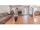 Spacious living room with hardwood floors, fireplace, and large windows offering ample natural light at 704 Stonecrest Ln, Loganville, GA 30052