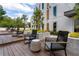 A beautifully landscaped outdoor common area with modern seating, lush plants, and inviting ambiance at 775 Juniper St # 405, Atlanta, GA 30308