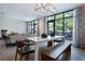 Open concept dining area with large windows and stylish furnishings, perfect for entertaining and relaxation at 775 Juniper St # 405, Atlanta, GA 30308