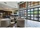 Inviting resident lounge with high ceilings, lots of natural light, and modern decor perfect for relaxing at 775 Juniper St # 405, Atlanta, GA 30308