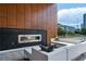 Outdoor patio featuring a fireplace, comfortable seating, and city views, perfect for entertaining at 775 Juniper St # 405, Atlanta, GA 30308