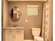 Bathroom featuring a vanity with granite countertop, oval mirror, and shower with decorative curtain at 836 Wood Nw St, Atlanta, GA 30318