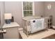 Charming Bedroom with a cozy crib and soft decor, perfect for a peaceful haven at 836 Wood Nw St, Atlanta, GA 30318