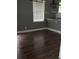 An empty dining area with hardwood floors and natural light from the window at 836 Wood Nw St, Atlanta, GA 30318