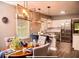 Modern eat-in kitchen with stainless steel appliances, granite countertops, and stylish pendant lighting at 836 Wood Nw St, Atlanta, GA 30318