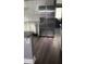 This kitchen boasts stainless steel appliances, white cabinets and granite countertops at 836 Wood Nw St, Atlanta, GA 30318