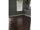 Cozy area with dark hardwood floors and a large window bringing in natural light at 836 Wood Nw St, Atlanta, GA 30318