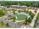 This aerial shows manicured community green space with gathering areas and paved walkways amid brick buildings at 916 Stratford Rd, Avondale Estates, GA 30002