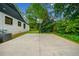 Spacious backyard featuring a basketball court and lush landscaping, great for outdoor activities at 916 Stratford Rd, Avondale Estates, GA 30002