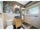 Stylish bathroom with black and white wallpaper, a glass-enclosed shower, and modern fixtures at 916 Stratford Rd, Avondale Estates, GA 30002